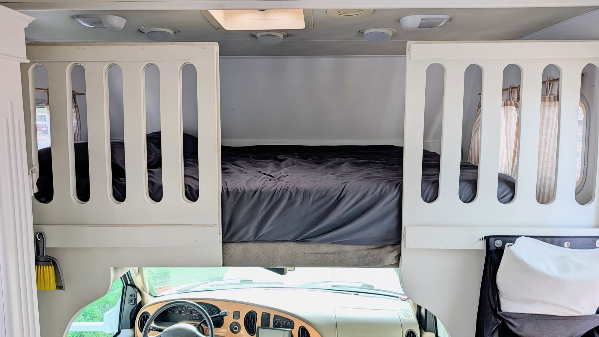 Overcab Queen bed with closable gate.